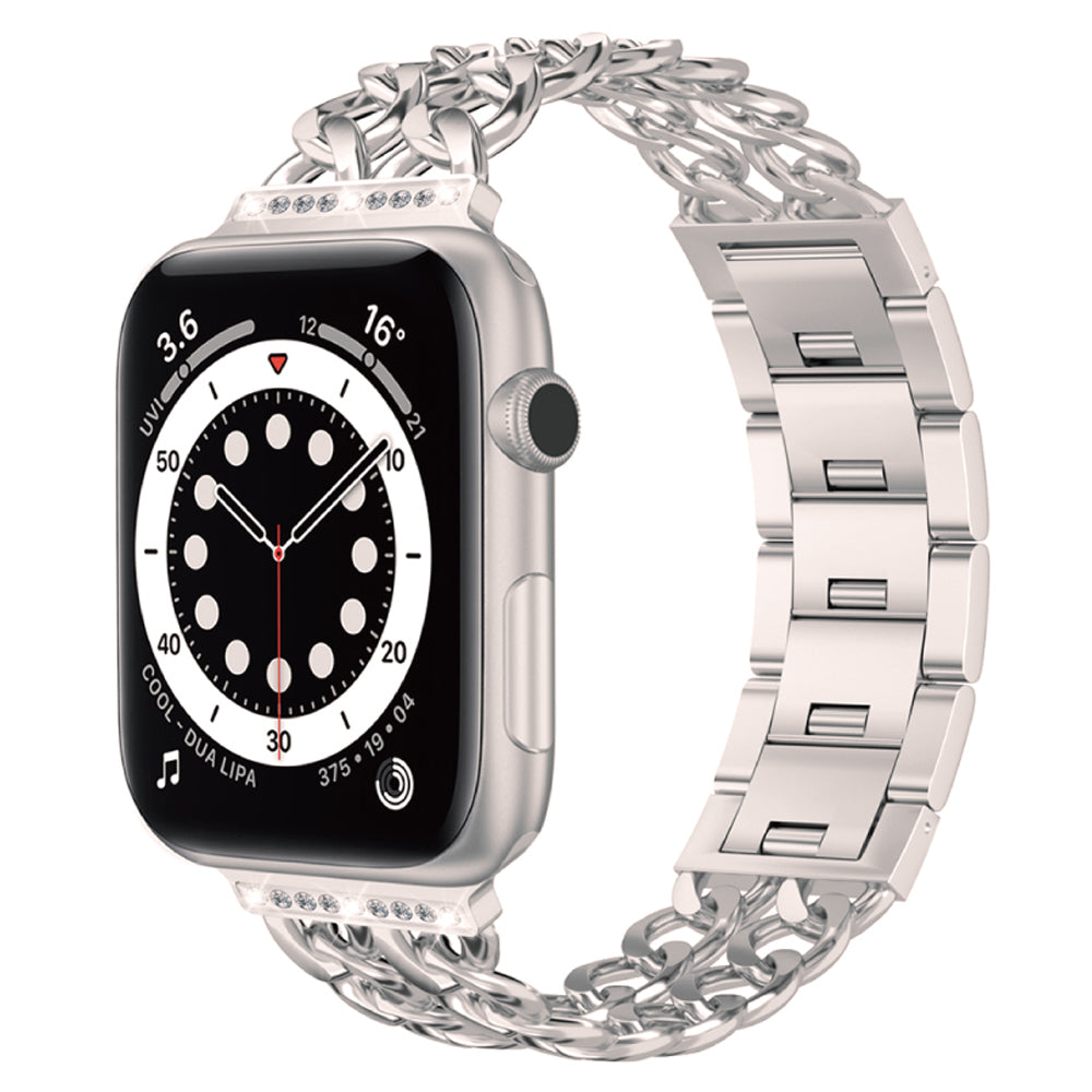 Das arktisband Apple Watch Armband „Princess“ von arktisband präsentiert sich in Silber mit einer glanzvollen Gliederstruktur, einem dekorativen Kettenglied-Metallband und einem Display mit analoger Uhr, Zahlen, Wetterinfos und Musikdetails.