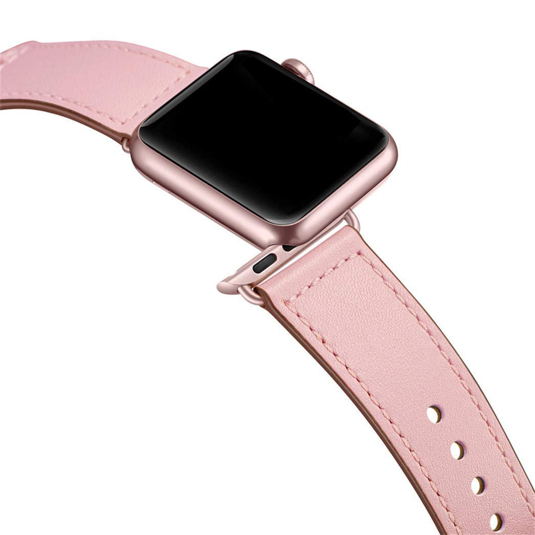 Eine Nahaufnahme einer Apple Watch mit einem rosafarbenen arktisband Apple Watch Kunstlederarmband von arktisband, mit maximalem Tragekomfort, minimalistischem Look und einem leeren schwarzen Bildschirm.