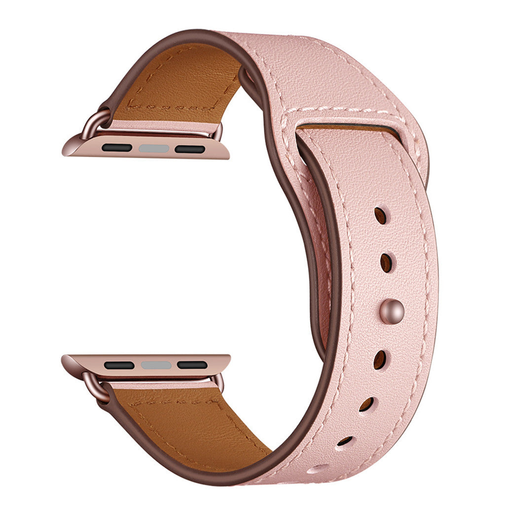 Das arktisband Apple Watch Lederarmband „Novus“ in Pink bietet braunes Futter, Metallverbinder an beiden Enden und mehrere Einstelllöcher für optimalen Komfort und minimalistischen Look – präsentiert auf weißem Hintergrund.