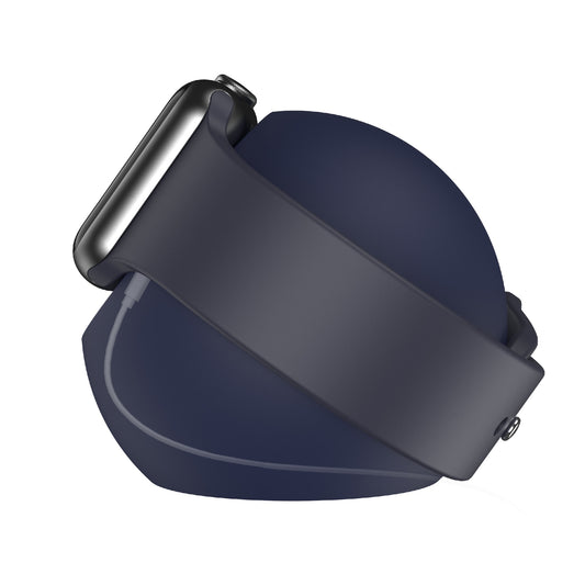 Eine dunkle Smartwatch mit passendem Band ruht auf dem runden arktis Apple Watch Orbit Stand, einem eleganten Silikon Ladegerät Halter von arktis, der für Ordnung auf dem Schreibtisch sorgt.
