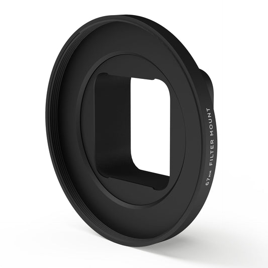 Der MOMENT 67 mm Moment Case kompatibler Filter Mount ist ein schwarzer, runder Adapter mit der Aufschrift "67mm FILTER MOUNT" an der Seite - ideal, um Ihren Lieblings-Moment-Filter an Ihrem Smartphone-Objektiv zu befestigen und flexibel zu fotografieren.