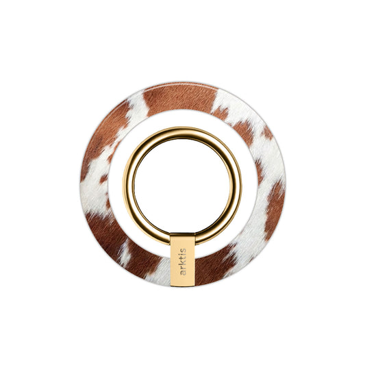 Runder Schminkpinsel mit goldenem Ring und braun-weißem Kuh-Print, inspiriert vom arktis Magnetischer Ringhalter für MagSafe - Cow für einen einzigartig stilvollen Look.