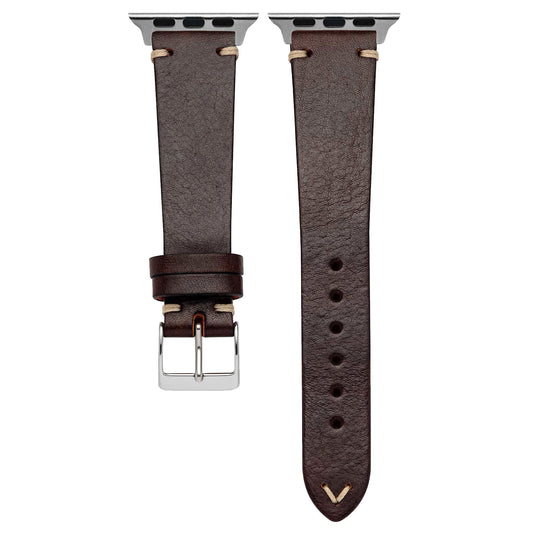 Abgebildet sind zwei dunkelbraune arktisband Apple Watch Lederarmbänder „Toskana“ von arktis aus pflanzlich gegerbtem Leder mit sichtbaren Nähten und silberner Hardware – eines mit Schnalle, das andere mit Einstelllöchern, beide mit Smartwatch-Anschlüssen.