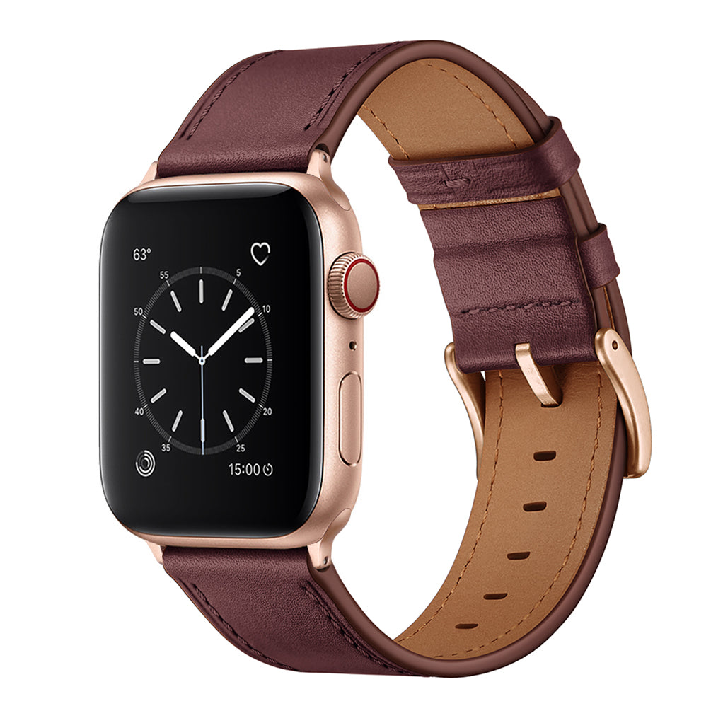 Eine goldene Smartwatch mit einem braunen arktisband Apple Watch Lederarmband "Premium" von arktisband, das ein analoges Ziffernblatt auf dem Bildschirm anzeigt.