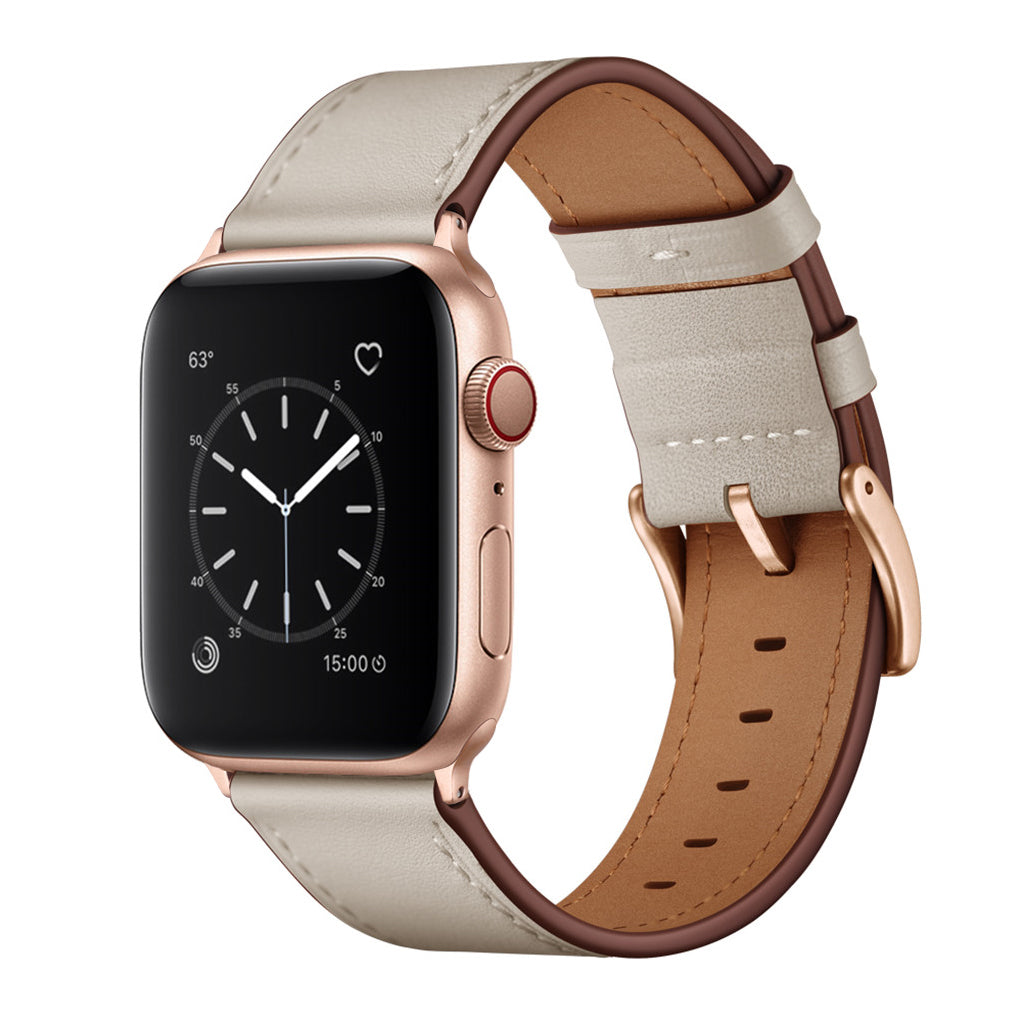 Das arktisband Apple Watch Lederarmband "Premium" von arktisband ist ein beigefarbenes Echtlederband, das schräg an einer roségoldenen Smartwatch mit rundem Display gezeigt wird - Apple Watch kompatibel für vielseitigen Style.