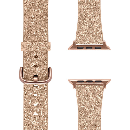 Das arktisband Apple Watch Glitzerarmband „Sparkle Star“ von arktisband wird in drei goldenen Glitzerteilen gezeigt – eines mit Schnalle, zwei mit Apple Watch-Anschlüssen – alle mit glitzernder Textur und passender metallisch-goldener Hardware.