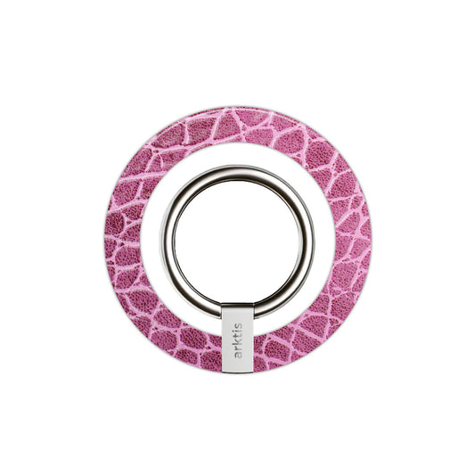 Ein kreisrunder, rosa-weißer MagSafe Ringhalter von arktis mit Eidechsenstruktur und dem markentypischen Zubehör für Ihr iPhone.