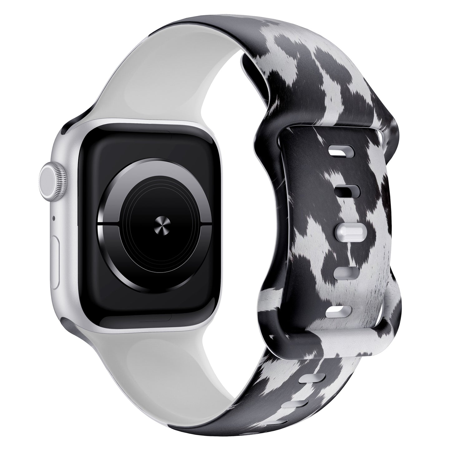 Das arktisband Kuhfell Apple Watch Armband zeigt einen schwarz-weißen Kuhdruck auf Silikon, hier auf einer silbernen Apple Watch in der schrägen Seitenansicht - ideal für sportliche Aktivitäten.