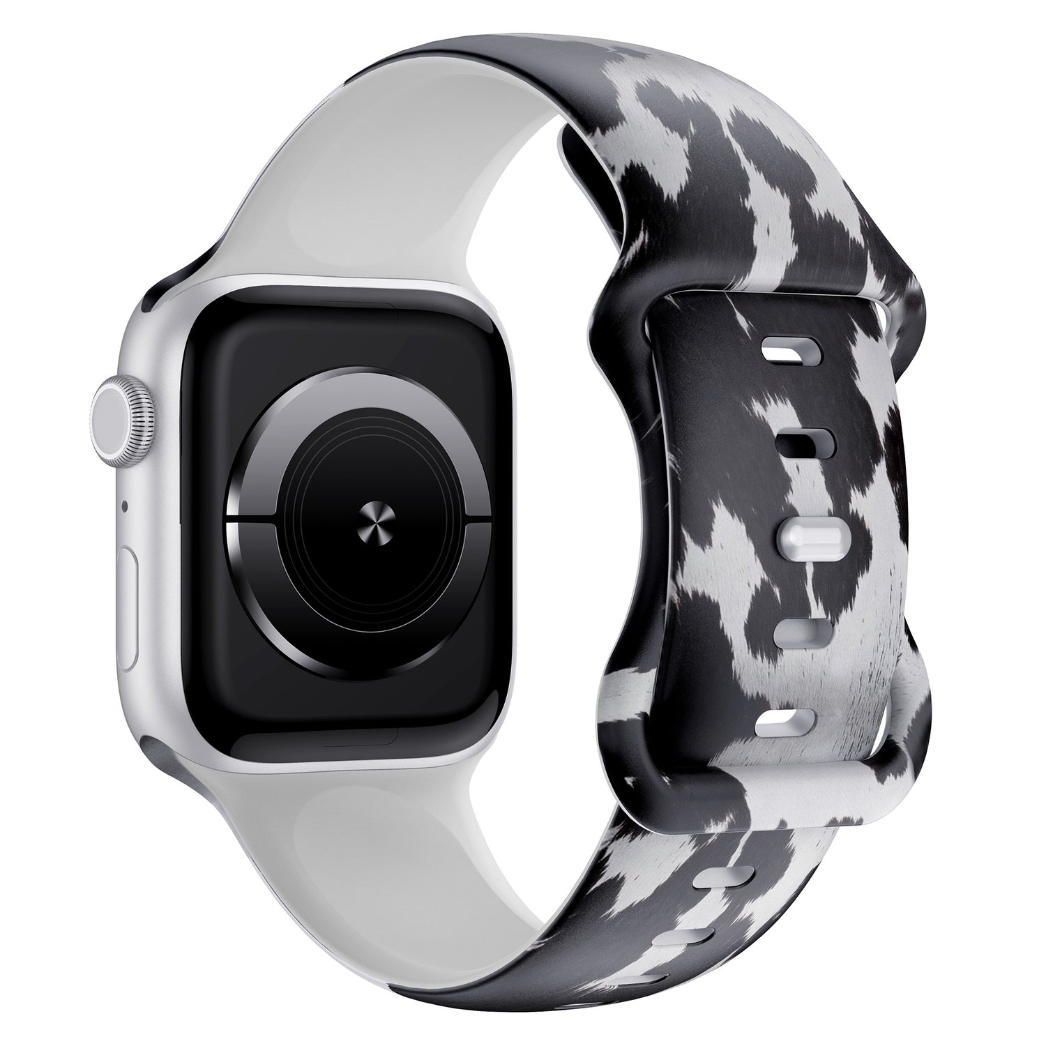Das arktisband Kuhfell Apple Watch Armband zeigt einen schwarz-weißen Kuhdruck auf Silikon, hier auf einer silbernen Apple Watch in der schrägen Seitenansicht - ideal für sportliche Aktivitäten.