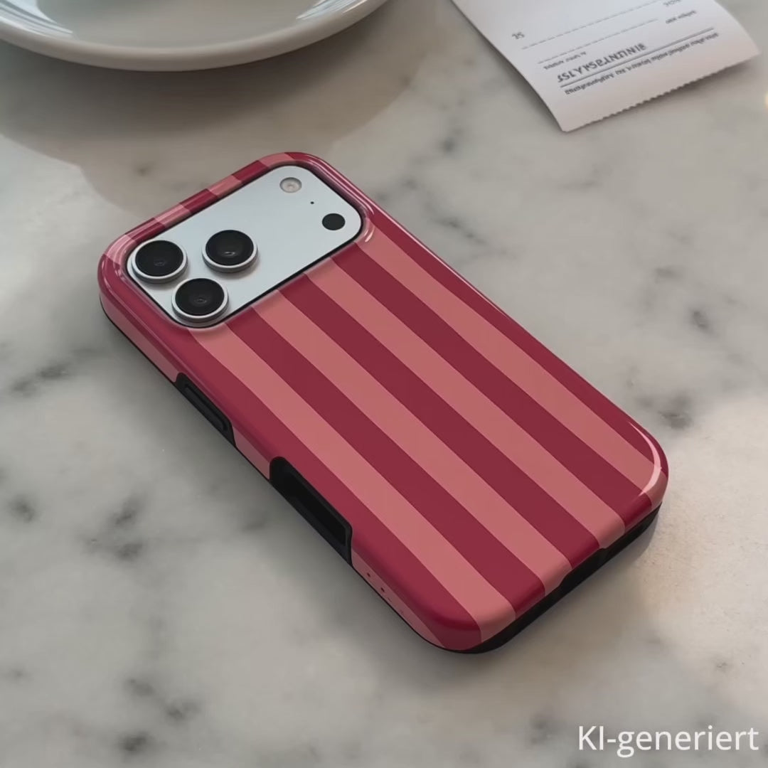 Frau hält eine iPhone Hülle in der Hand. Die Hülle ist rosa-rot-gestreift und hat die Aufschrift "follow your fucking dreams". KI-generiert.