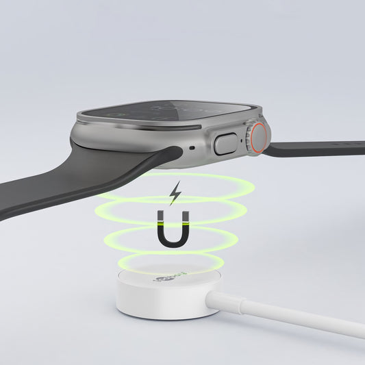 Ein Goobay Magnetisches Ladegerät für Apple Watch 1 m lädt kabellos, während grüne Energiestrahlen und ein Blitzsymbol die innovative Ladetechnologie betonen.