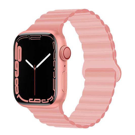Das arktisband Apple Watch Magnetarmband "Neo" besteht aus einem rosa Silikonarmband und einem passenden Gehäuse mit einem rechteckigen schwarzen Display, das von vorne auf weißem Hintergrund abgebildet ist. Kompatibel mit der Apple Watch für zusätzlichen Komfort.