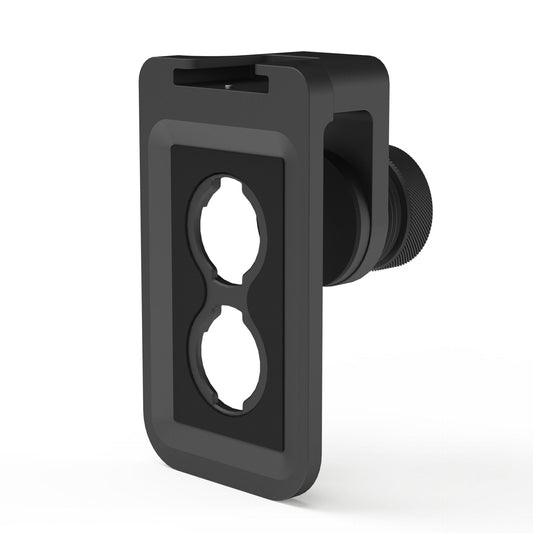 Der MOMENT Universal Lens Mount Clip T-Series ist eine schwarze Kunststoff-Wandplatte mit zwei kreisförmigen Aussparungen, die für die Montage über Steckdosen oder als universelle Objektivhalterung für Moment T-Series Objektive und iPhone Objektivhalter konzipiert ist.
